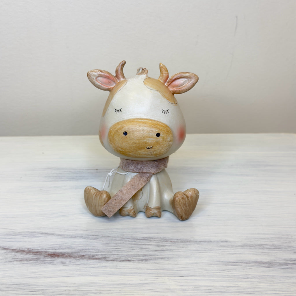 Whimsical Sitting Cow