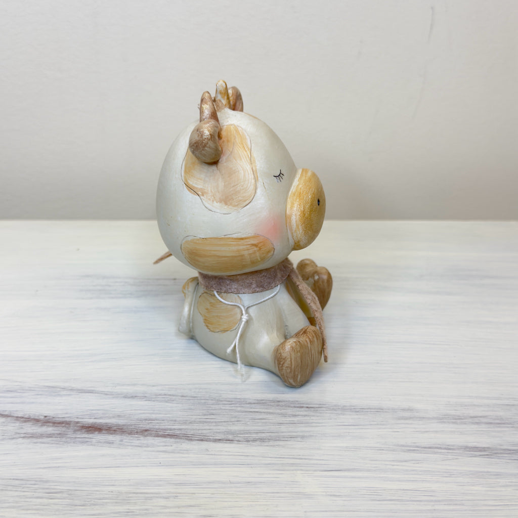 Whimsical Sitting Cow