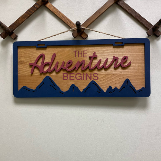 The Adventure Begins Sign