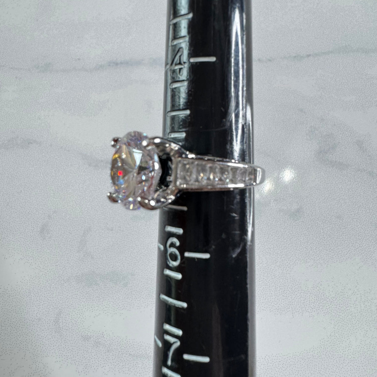 Round Cut Ring With Tapered Baguettes - Size 5