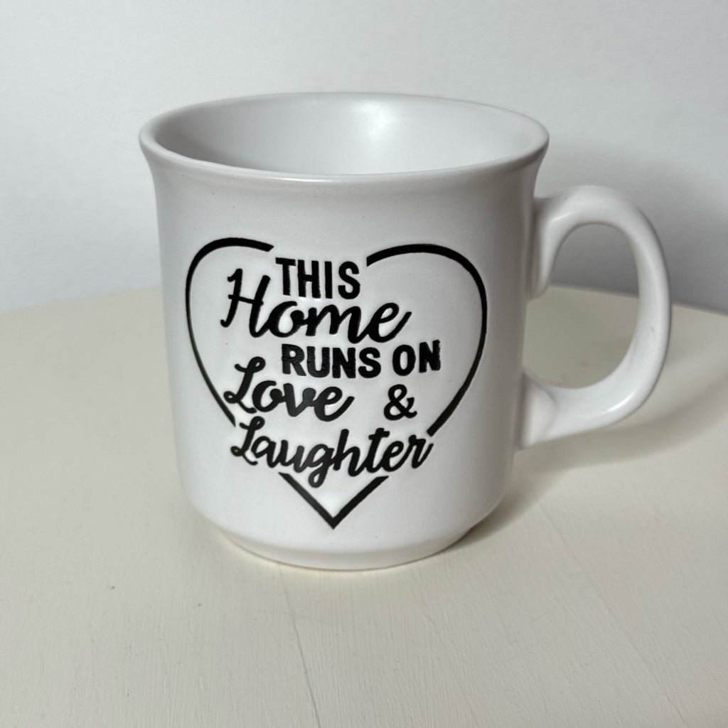 This Home Runs on Love & Laughter Mug