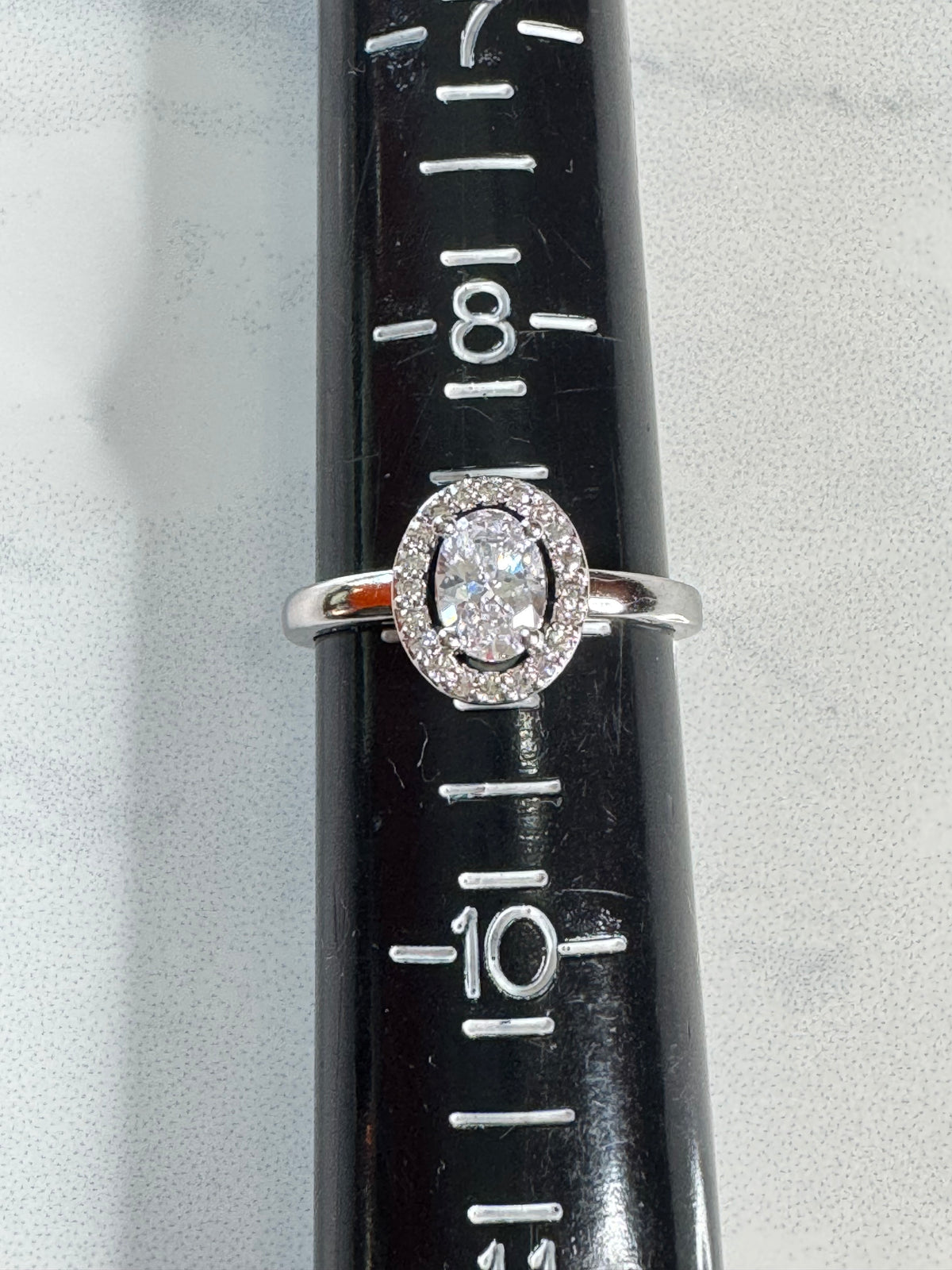 Elegant Oval Cut Simulated Diamond Halo Ring - Size 9