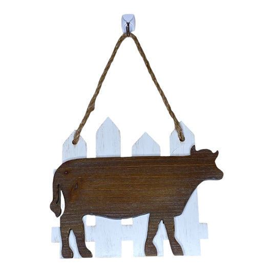 Hanging Cow By Fence